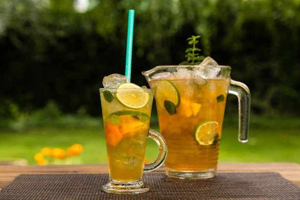 istock Homemade peach ice tea with lime and lemon balm 819716458