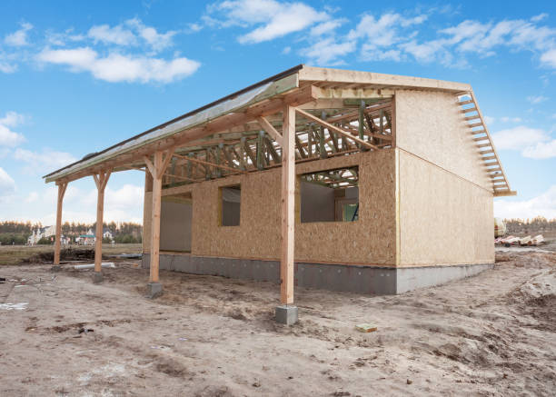 istock Modern frame energy efficient house under construction with membrane coverings, roof shingles and insulation materials 819717404