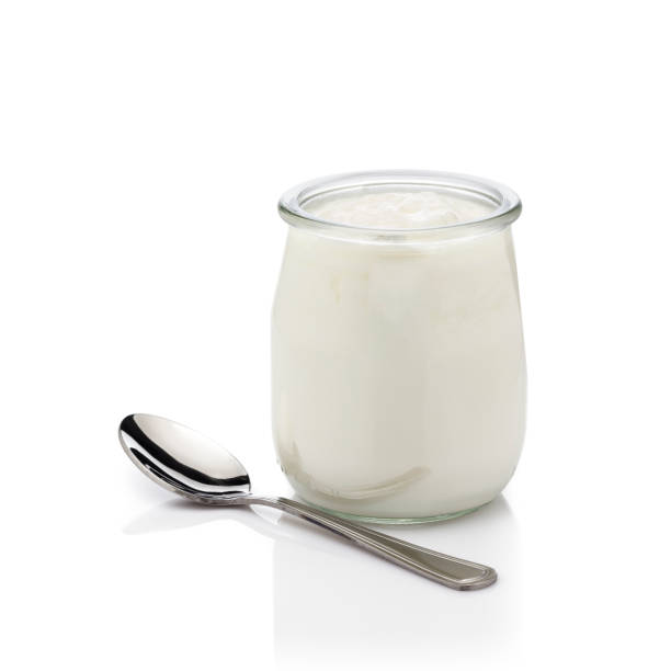 Yogurt in a glass container isolated on white background