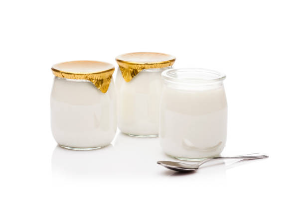 istock Yogurt in a glass containers shoot on white background 819720220