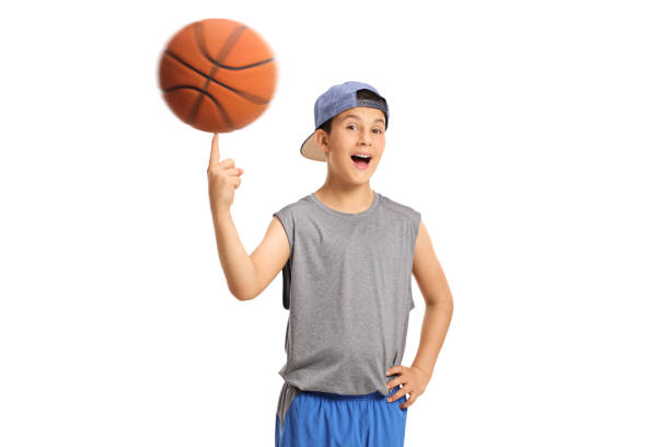 istock Joyful boy spinning a basketball on his finger 819720562