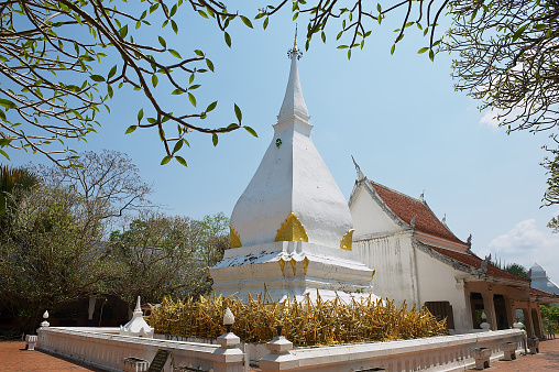 Exterior of the Phra That Si Song Rak temple with the inclined stupa in Loei, Thailand.