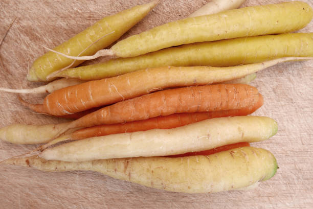 istock Yellow, White and Orange Carrots 819730646