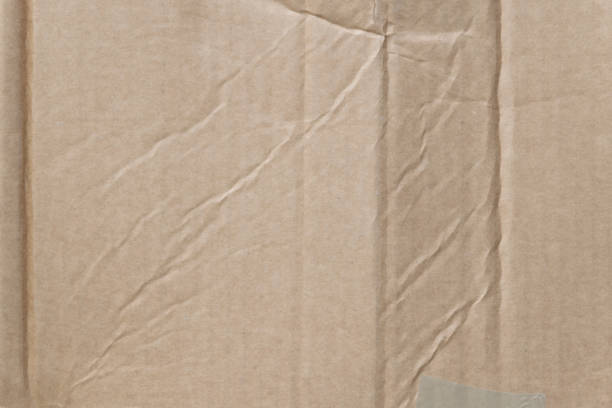 istock close-up brown cardboard with sticky tape texture background 819738142
