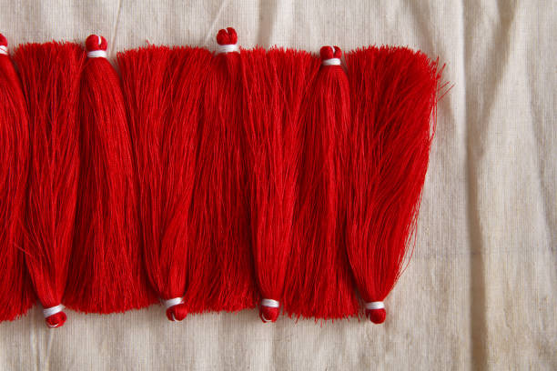 istock Red tassels line close up 819749114