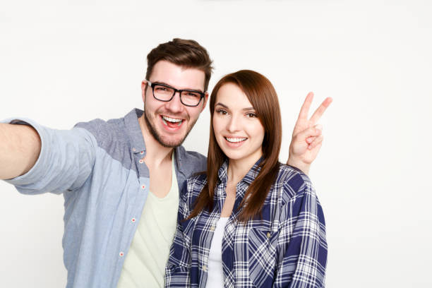 istock Couple taking selfie for social media, isolated 819751590