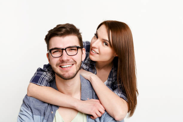 istock Happy casual couple posing to camera, isolated 819753762