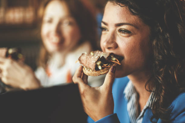 istock Woman eating in cafe 819762118