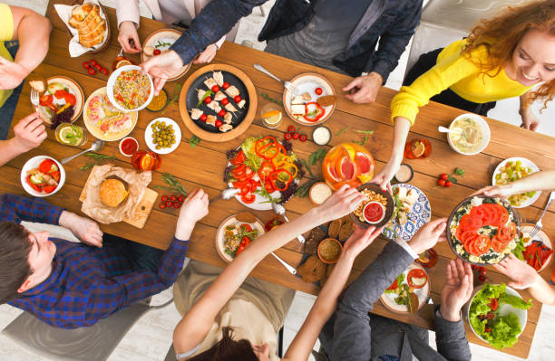 istock People eat healthy meals at served table dinner party 819762920