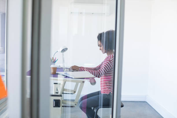 istock Female executive working over laptop 819763212