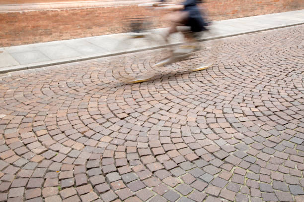 Cyclist on Cobblestone Street, Modena; Italy