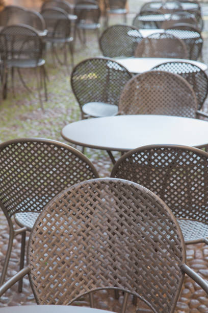 istock Cafe Table and Chairs on Cobblestone Street, Bologna 819765886
