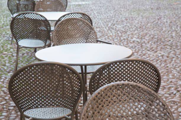 istock Cafe Table and Chairs on Cobblestone Street, Bologna 819766864