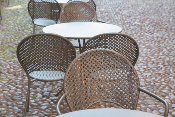 Cafe Table and Chairs on Cobblestone Street, Bologna, Italy