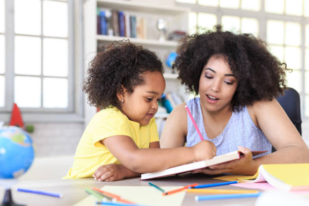 istock Teacher learning little girl 819770674