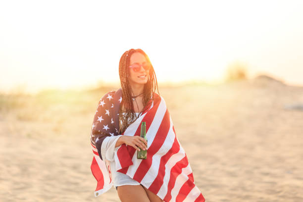 istock Young woman wears national flag 819770794