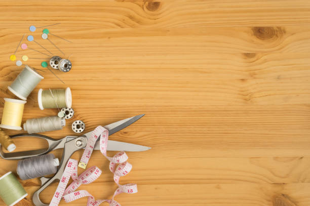 istock top view of tools for handicraft sewing on wood texture, space for input text 819771124