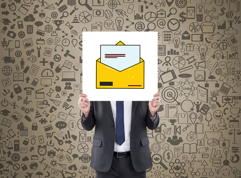 Businessman holding placard with inbox e-mail icon