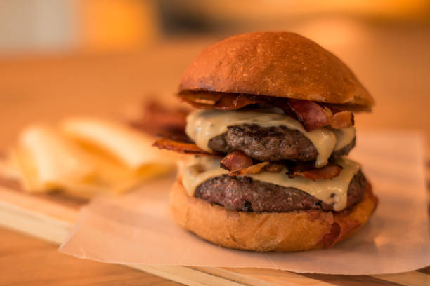 istock hamburguer artisan in table wood background 819772310
