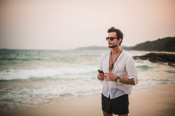 istock Hipster listening to music 819781528