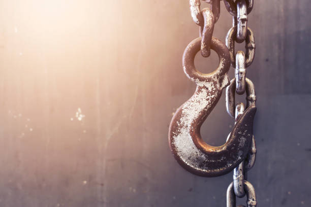istock old chain and hook with with soft-focus in the background and over light 819784458