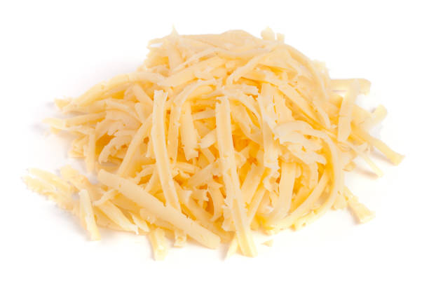 istock Heap of grated cheese isolated on white background 819786592