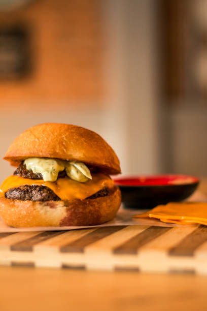 istock hamburguer artisan in table wood background 819792620