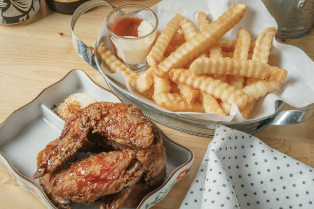 istock Deep fried chicken wing and french fries 819799016