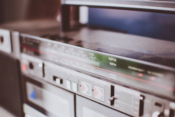 istock Retro dusty boombox (tape recorder) on shelf in garage 819805986