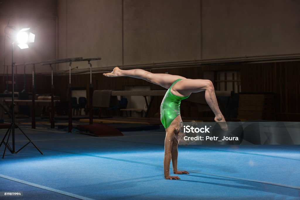 portrait of young gymnasts competing in the stadium portrait of young gymnasts competing in the stadium, retouched Artistic Gymnastics Stock Photo