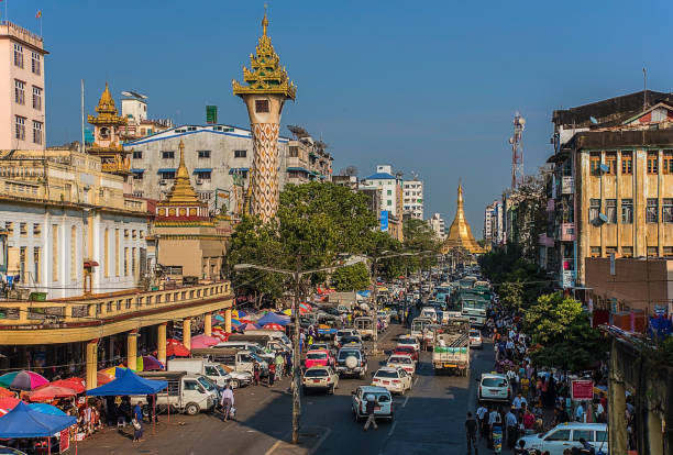 Yangon city in Myanmar Main street leading to the Sule pagoda in Yangon city, a normal day in Myanmar capital shwedagon pagoda photos stock pictures, royalty-free photos & images