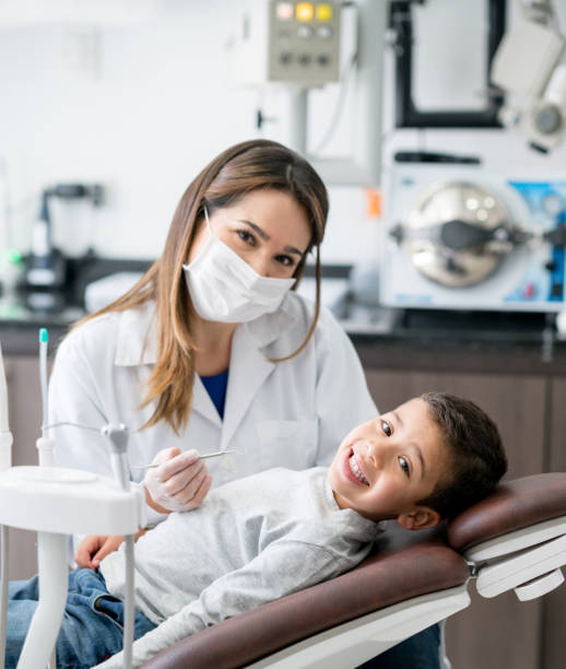 istock Happy boy at the dentist 819818138
