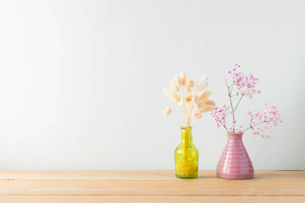 istock Indoor plant on wooden table and white wall 819818160