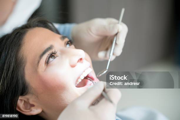 Portrait Of A Woman At The Dentist Stock Photo - Download Image Now - Dental Health, Dentist, Dental Equipment