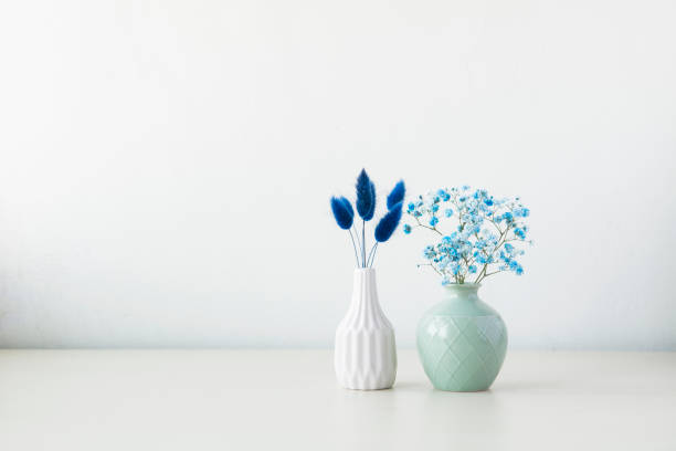 istock Indoor plant on wooden table and white wall 819823142