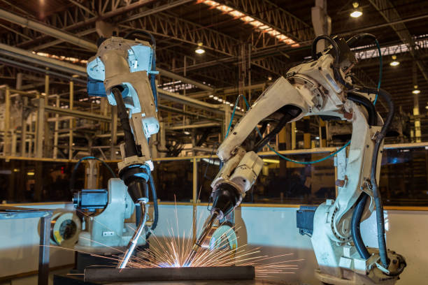 istock Robots are welding in car factory 819826652