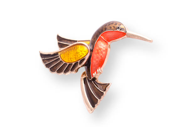 istock enamel brooch with Hummingbird isolated on white 819833286