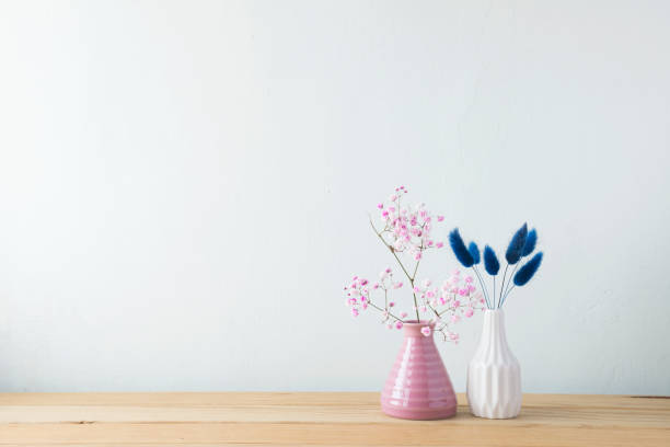istock Indoor plant on wooden table and white wall 819839374