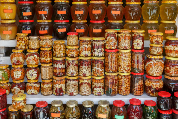 istock Many glass jars with jam, honey and nuts 819839876