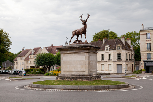 Senlis, France - July 19 2017: Bronze statue of a deer, place du Chalet, northeast of downtown. The statue was made in 1877 by sculptor Pierre Louis Rouillard.