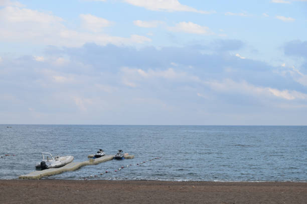 istock Rubber speed boat and two Jet Skies moored to the plastic floating jetty 819844010