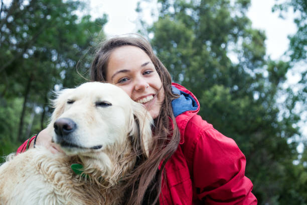 istock Girl with pet labrador retriever 819845536