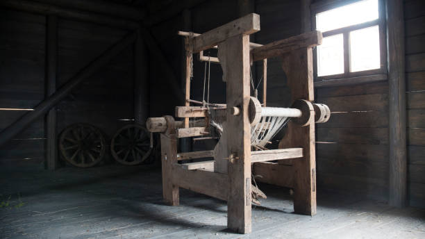 istock Old age wooden loom machine - manually operated mill machinery 819847710