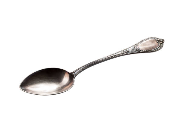 Top view of vintage silver cutlery or silverware on grey concrete background