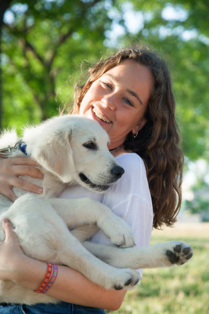 istock Girl with pet labrador retriever 819850844
