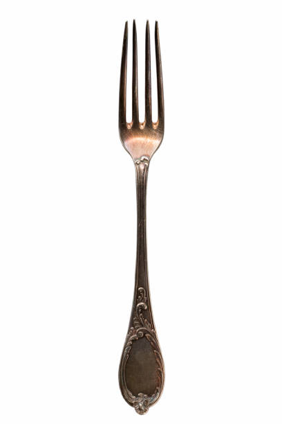 Single old antique cutlery fork isolated on white background, clipping path included
