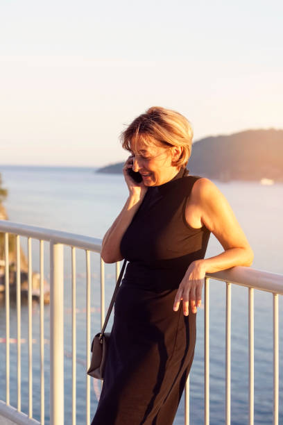 istock Mature  woman using mobile phone 819877870