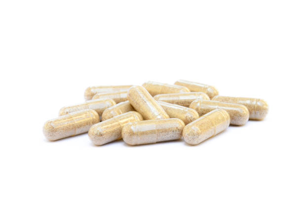 istock Natural medicine capsules isolated on a white background 819878008