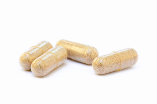 istock Natural medicine capsules isolated on a white background 819878022