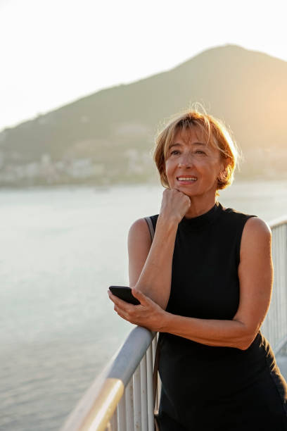 istock Mature  woman using mobile phone 819883128